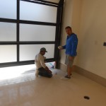 Finishing Touches on Epoxy Floor in Garage
