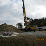 Crane Setting Equipment Down in Basement